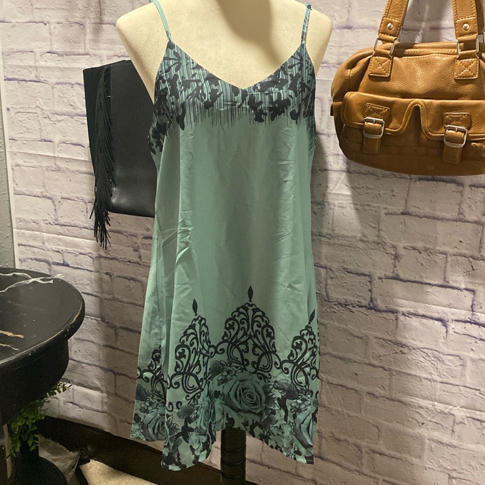 Light airy summer dress. This dress is lined and has adjustable straps.